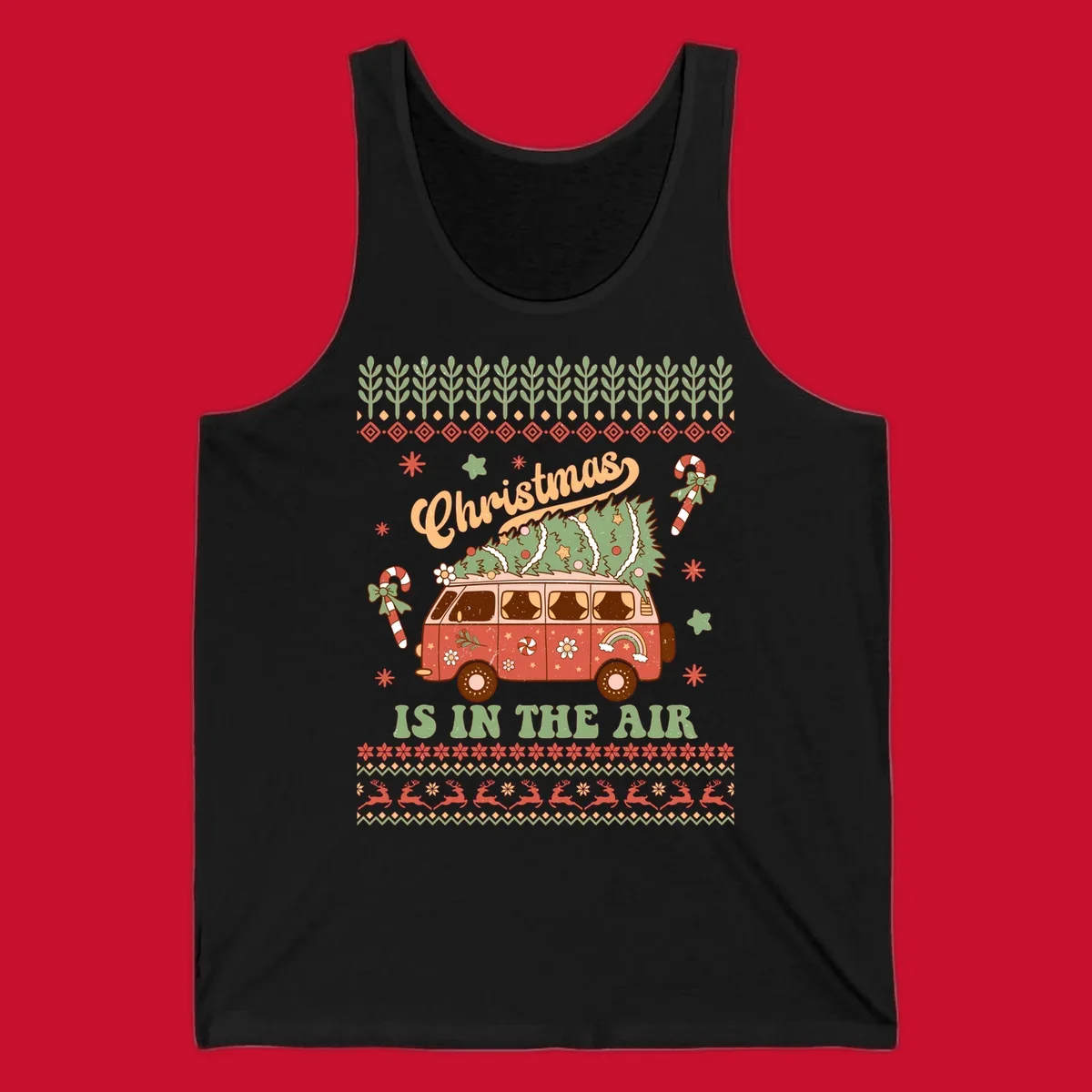 Retro Christmas van with tree on roof and 'Christmas IS IN THE AIR' text.