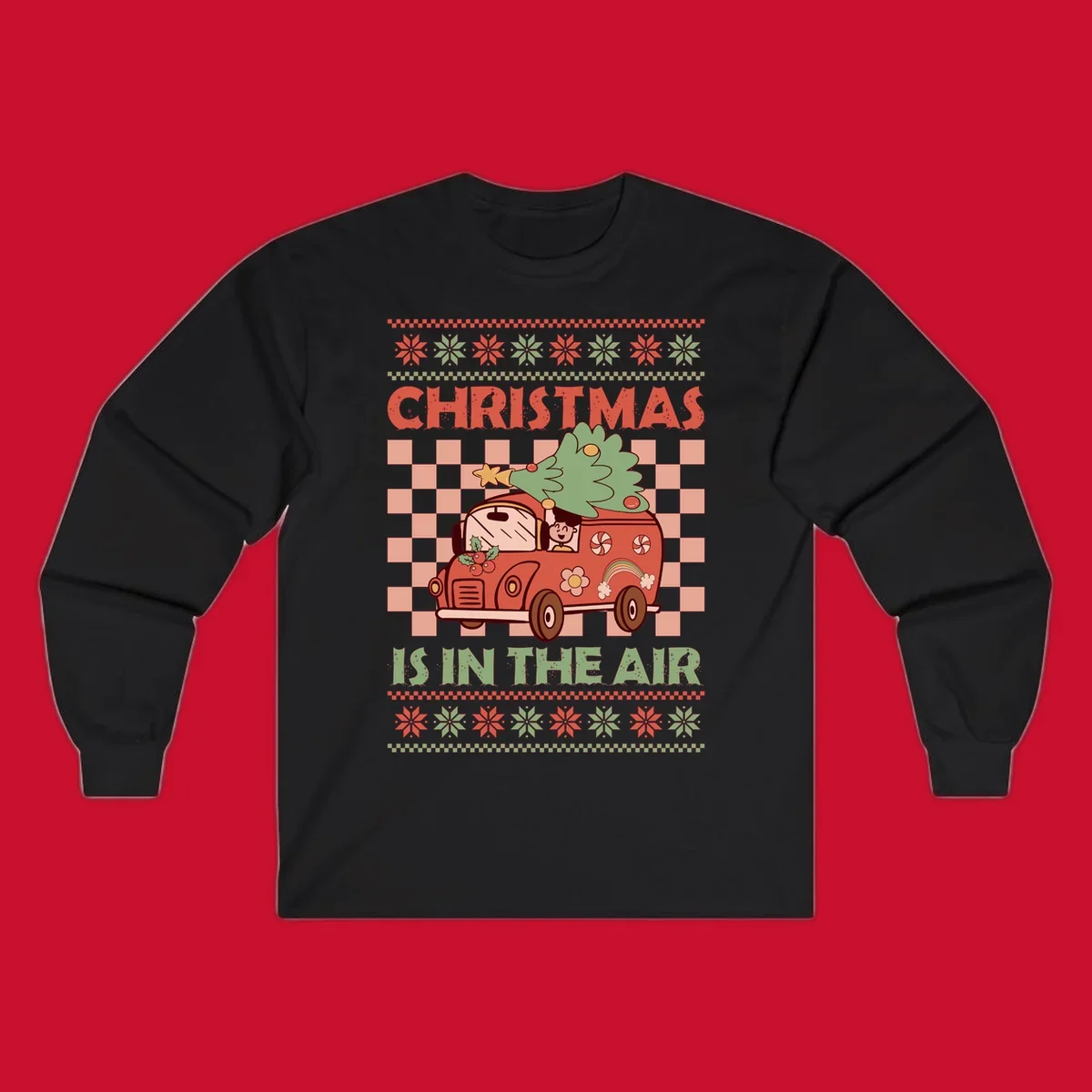 Christmas van with tree on top, text 'Christmas Is In The Air', snowflake borders, checkered pattern.
