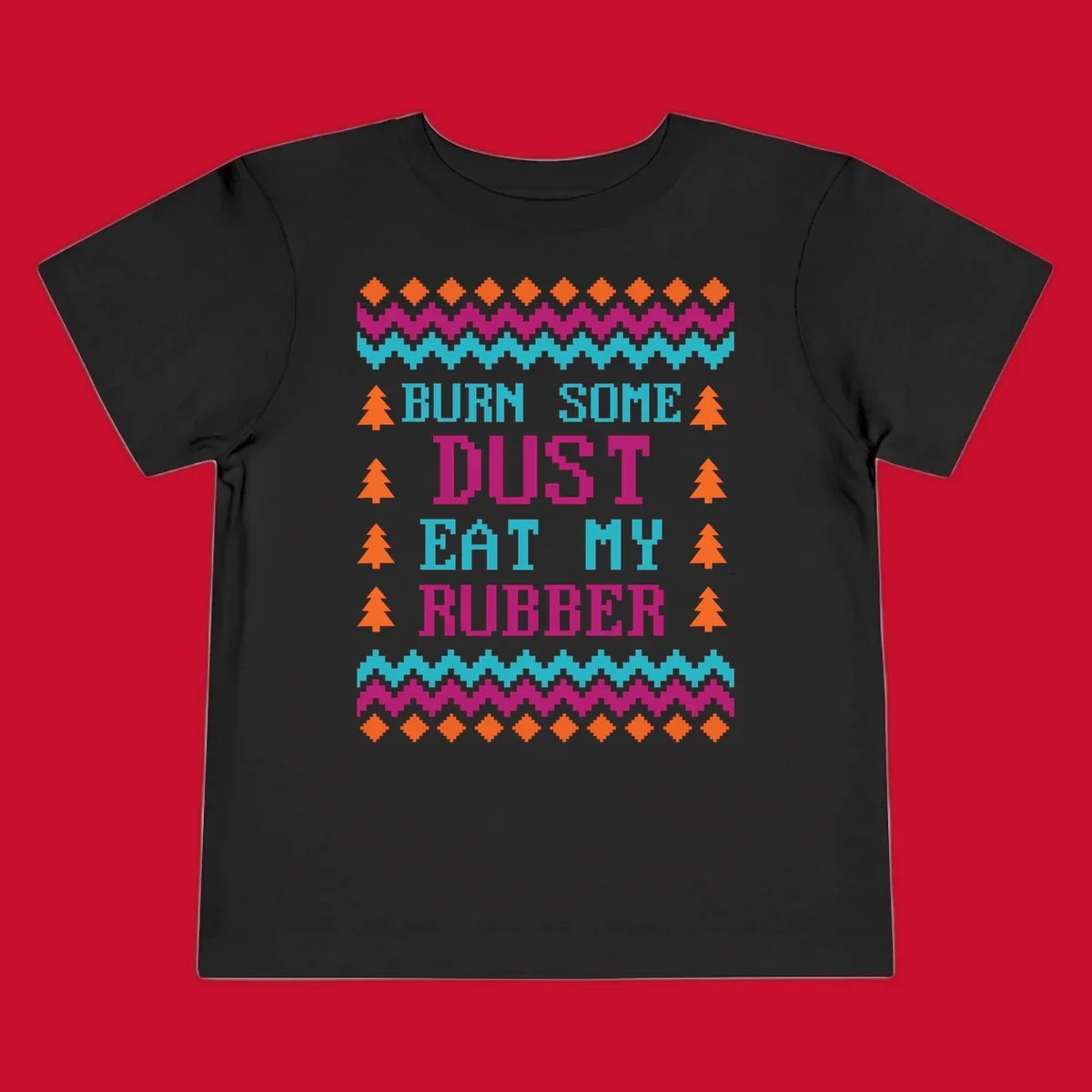 Pixelated text design 'BURN SOME DUST EAT MY RUBBER' with Christmas trees and zig-zag patterns.