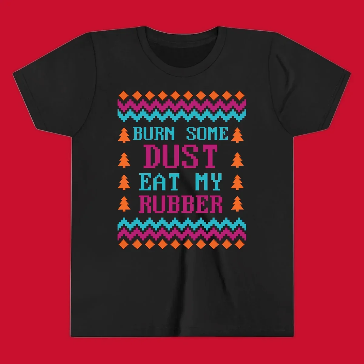 Pixelated text design 'BURN SOME DUST EAT MY RUBBER' with Christmas trees and zig-zag patterns.