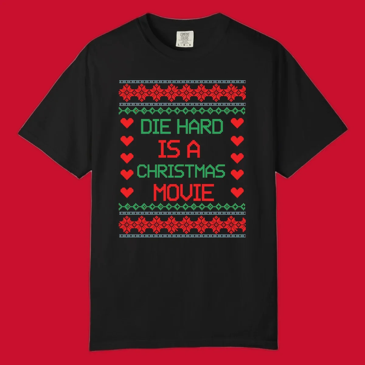 Die Hard is a Christmas Movie pixel art design with red hearts and holiday patterns.