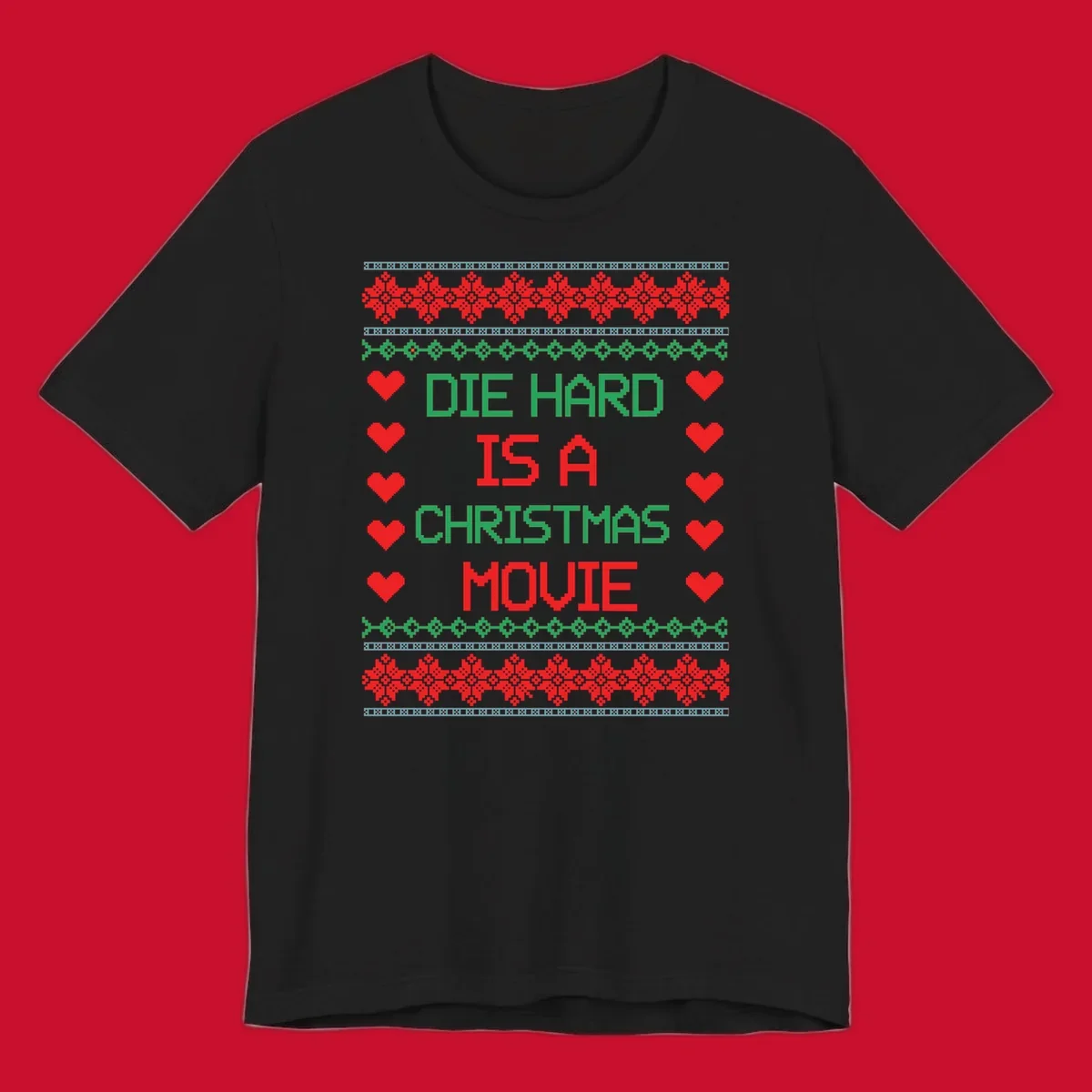 Die Hard is a Christmas Movie pixel art design with red hearts and holiday patterns.