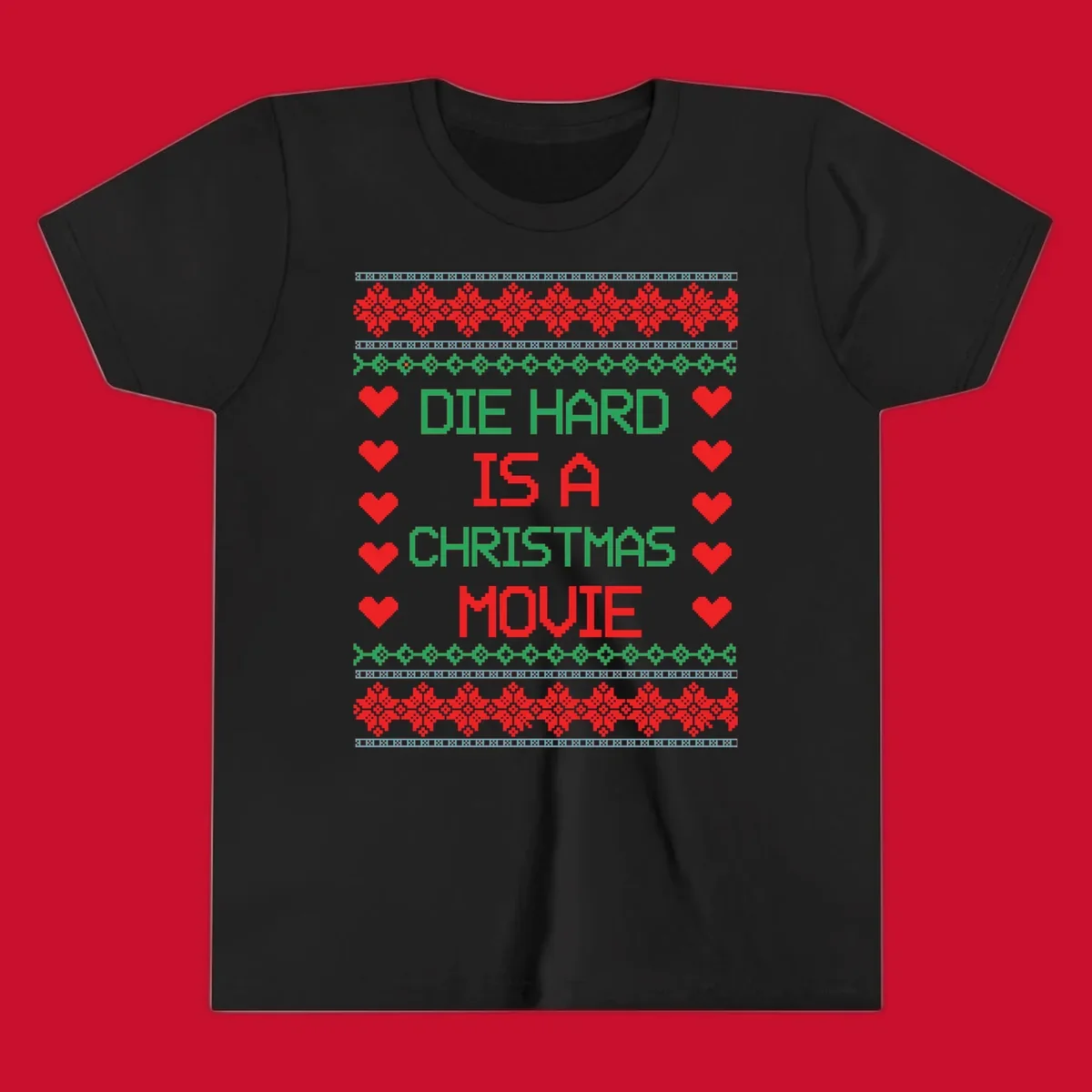 Die Hard is a Christmas Movie pixel art design with red hearts and holiday patterns.