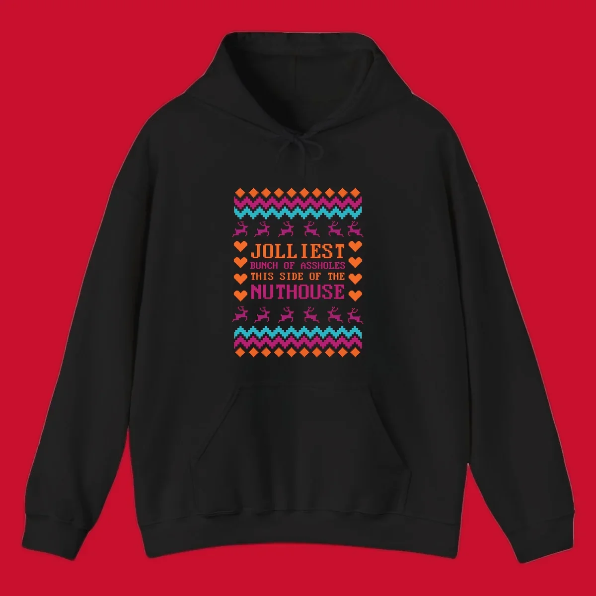 Jolliiest Bunch Of Assholes text with reindeer and heart graphics in an ugly sweater pattern.
