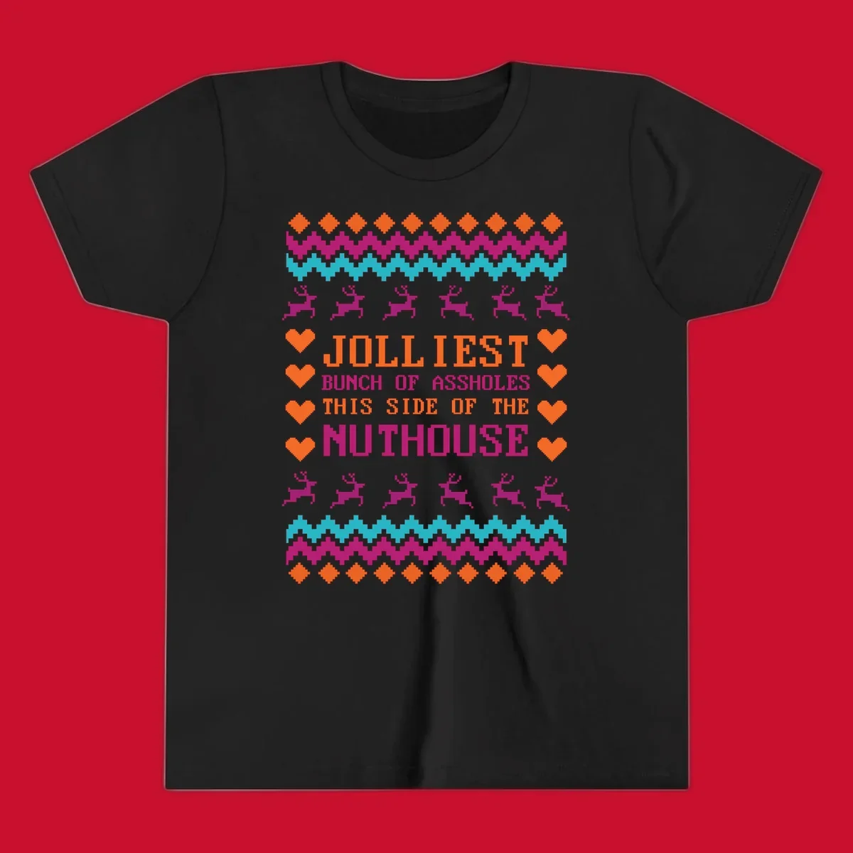 Jolliiest Bunch Of Assholes text with reindeer and heart graphics in an ugly sweater pattern.