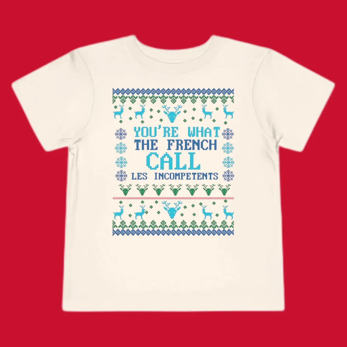 French Call Les Incompetents Ugly Christmas Sweater design with reindeer and snowflakes.