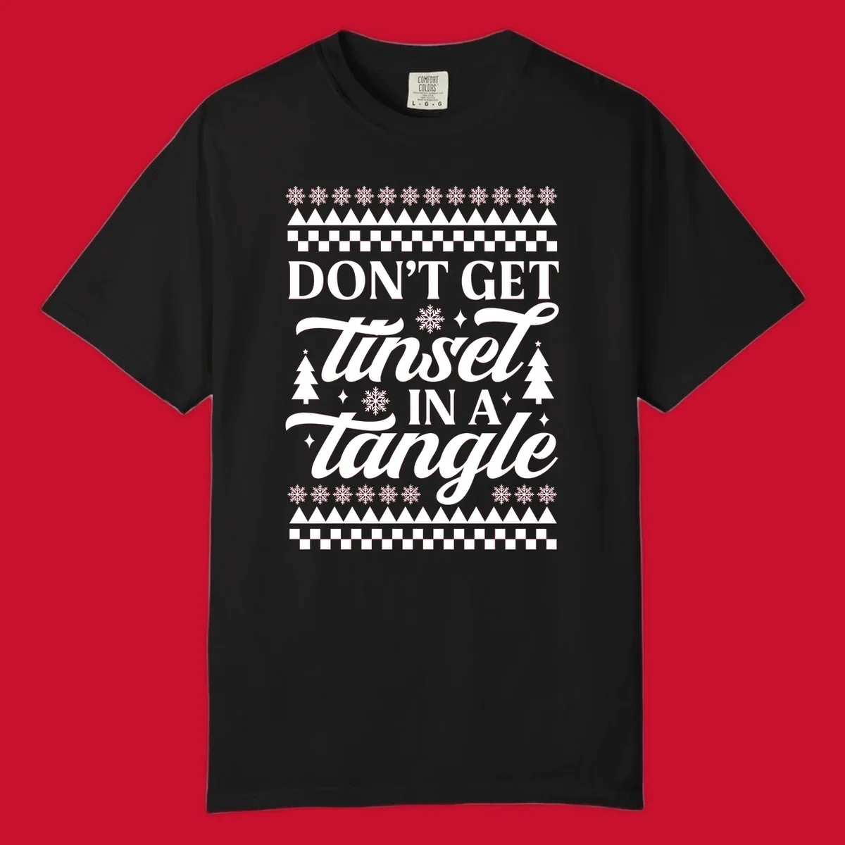 Don't Get Tinsel In A Tangle holiday design with snowflakes and trees.