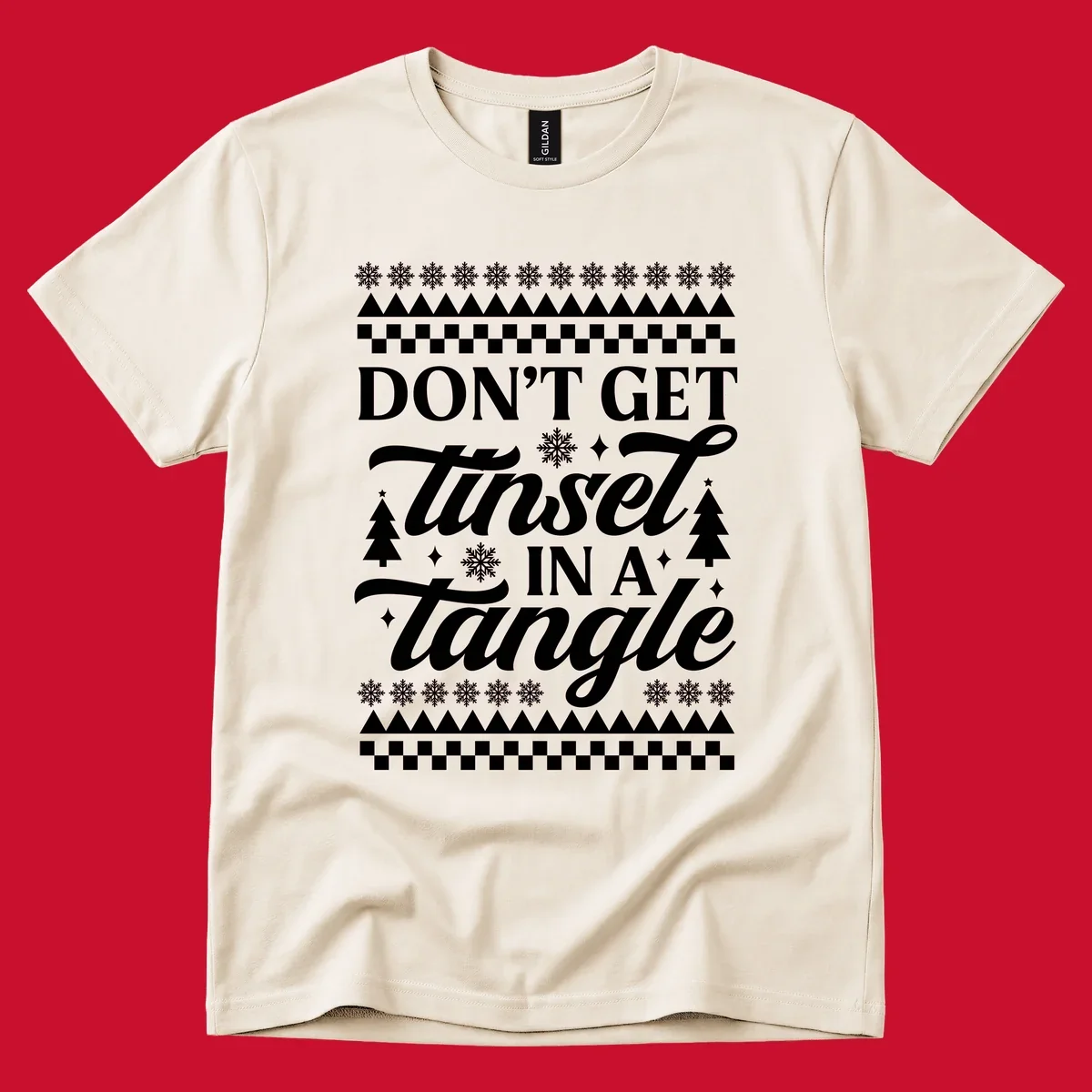 Don't Get Tinsel In A Tangle holiday design with snowflakes and trees.